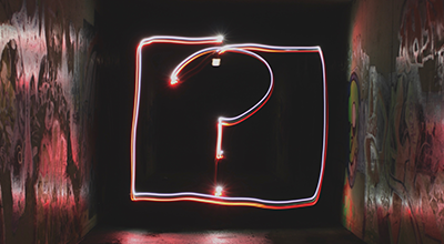 Question mark painted in neon light